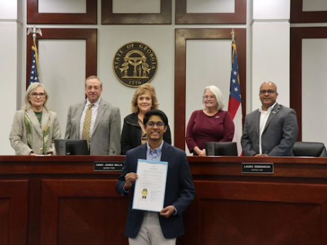 An image of Vinayak Menon receiving an award for his work against substance abuse in Forsyth County. (Taken from Forsyth Herald) Menon continues to work against substance abuse and is currently the president of Forsyth County’s Drug Awareness Council. 