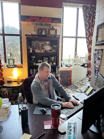 Coach Church working at his desk, taken by Sanhita Chatterjee on February 7, 2023.