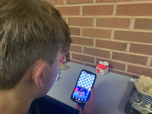 Lambert Sophomore Jacob Anders watching content creator Hikaru Nakamura on TikTok. TikTok has recently been the subject of bans on government owned devices in some states. Taken by Joshua Mui on February 10, 2023.