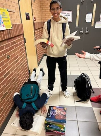Lambert freshmen Kumayl Kurori (left) and Taha Mustafa (right) working on common New Year’s Resolutions, with the former doing pushups while studying and the latter curling books in either hand. Taken by Sudarshan Prasanna on Jan 13, 2023.