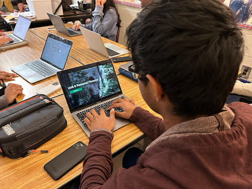 Lambert student Joshil Vaddi studies personal finance at school, learning about insurance. Photograph by Chitvan Singh, March 27th, 2023