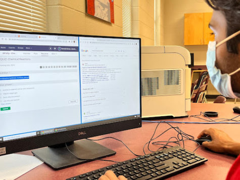 Enactment of a student cheating on an assessment during COVID. Picture taken by Sudarshan Prasanna on 5/19/2023.