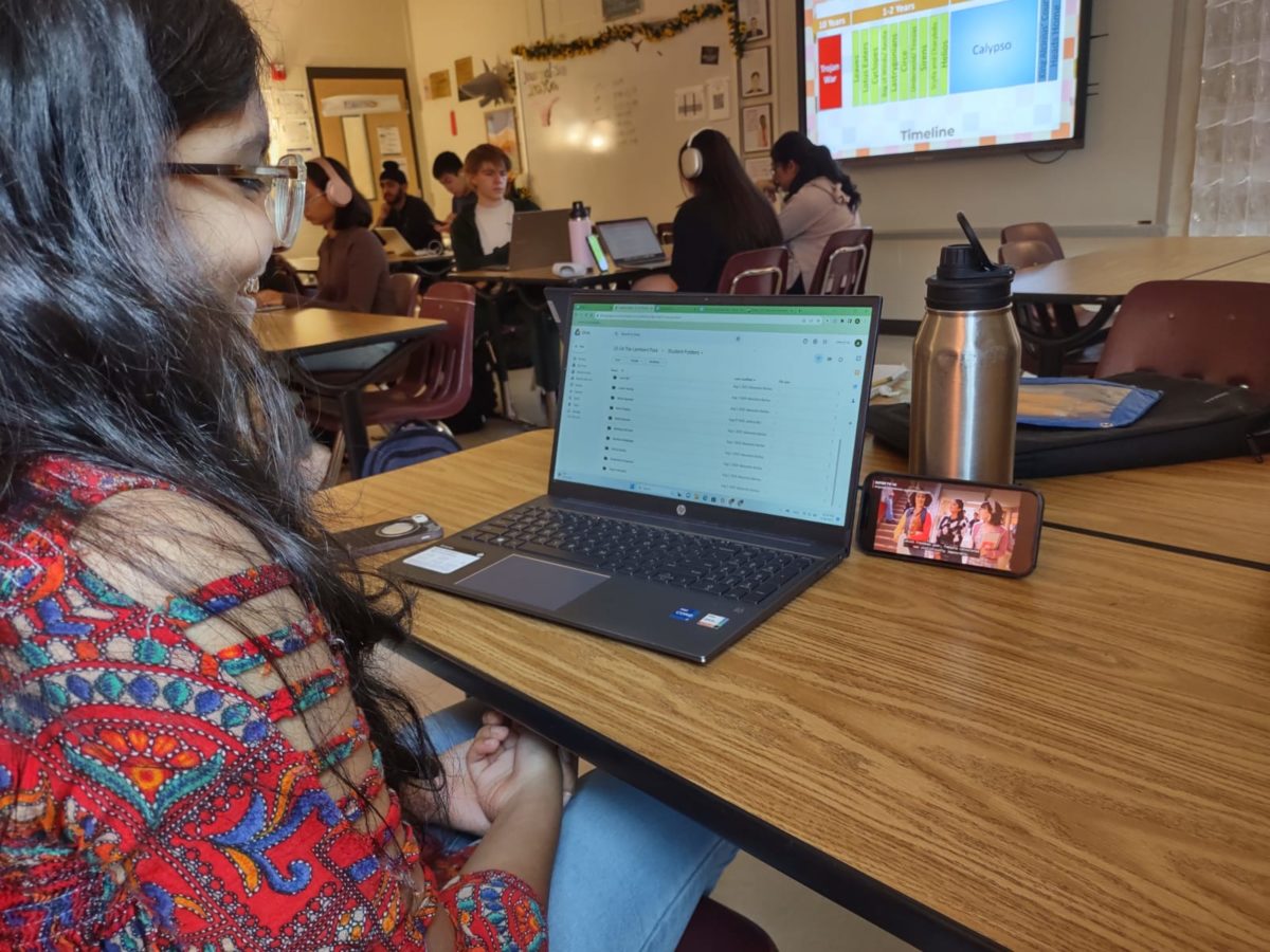 A student watching Devi and her friends navigate senior year in season 4 of Never Have I Ever. The show’s final season was released on Netflix June 8, 2023. (Sudarshan Prasanna/The Lambert Post)
