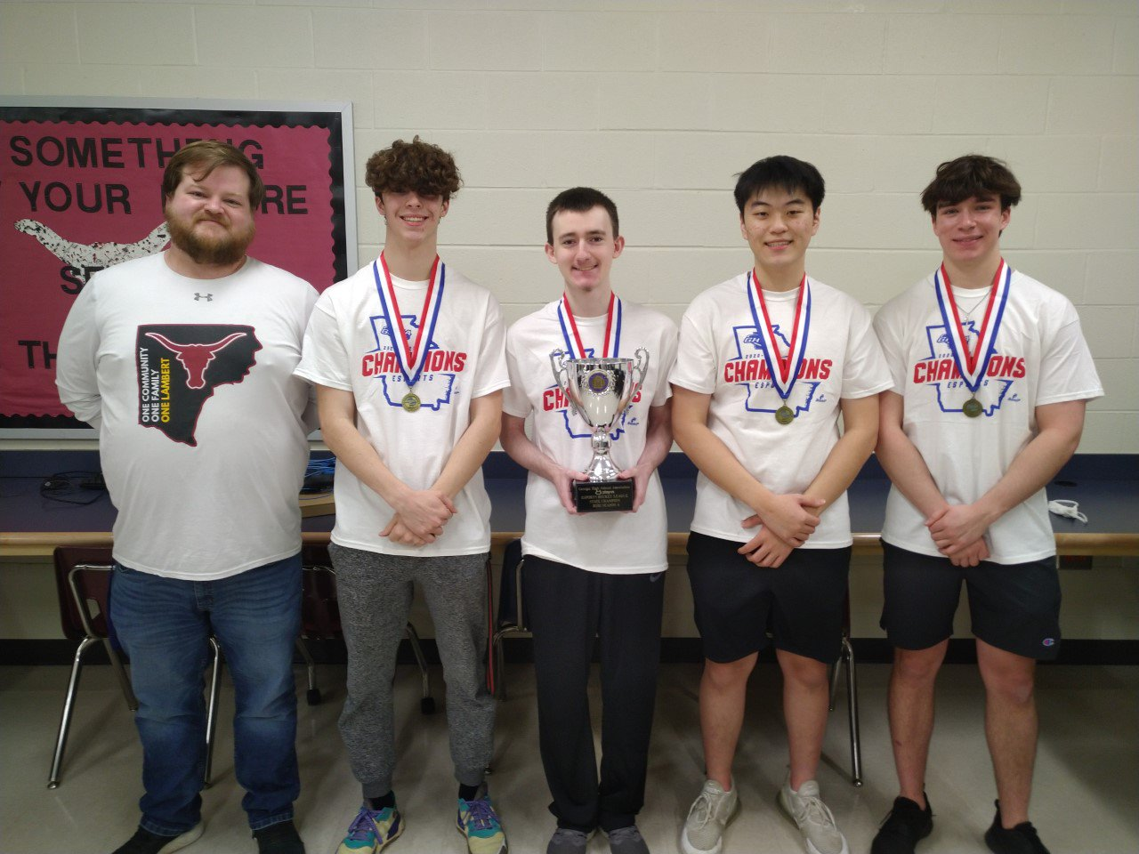 Lambert’s Esports club poses with their trophy after winning the state championship for Rocket League. (Courtesy of Lambert Esports)