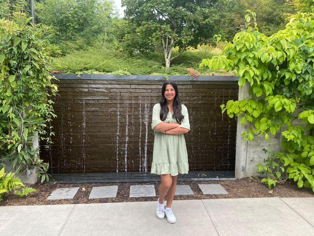 The picture above shows Freshman Ella Snyder posing in front of a fountain surrounded by greenery. One of the causes of Climate Change is deforestation. Planting more trees and plants can help slow it down. (Eera Ingle/The Lambert Post)