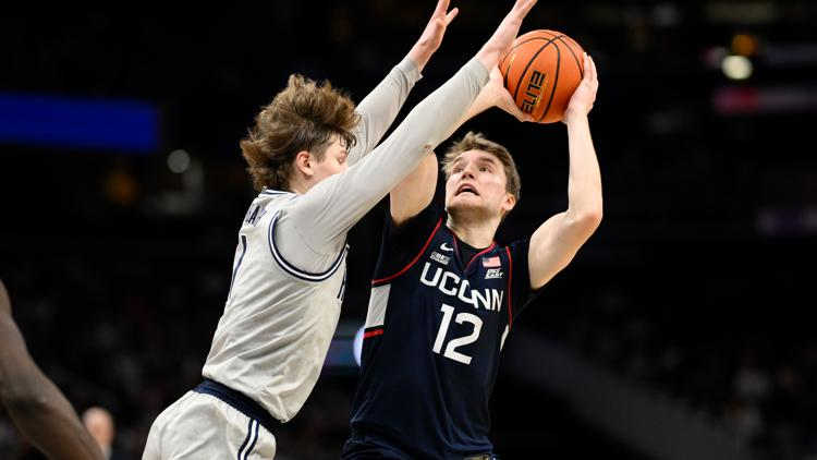 University of Connecticut Guard Cam Spencer takes a shot during a game. Courtesy of AP/Nick Wass.
