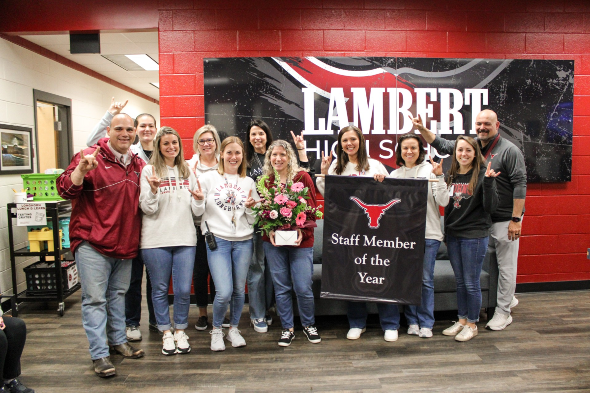 Photo taken of Mrs. Barnes and administrators (Lambert High School)