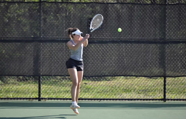 Mara Opre playing tennis at a match against South Forsyth High School on March 20. (Courtesy of Lambert High School)