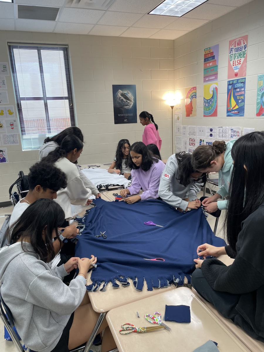 Members of Family Promise working together to create blankets (Courtesy of Hanna Kim)