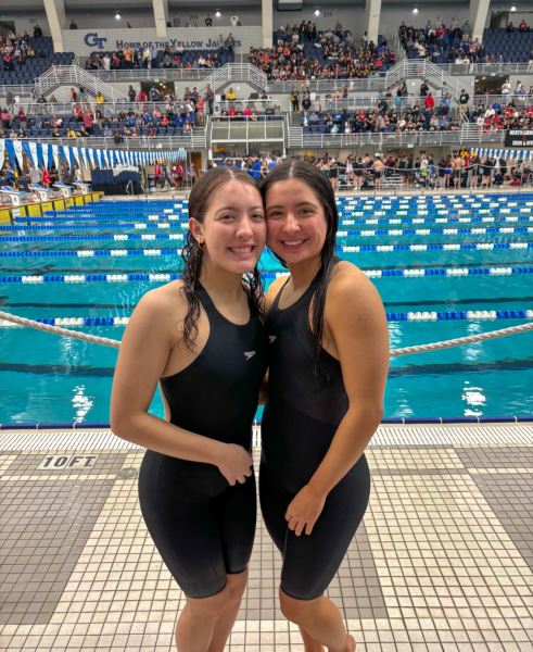 Katelyn and Brielle Thomas at a swim meet together. (Brielle Thomas)

