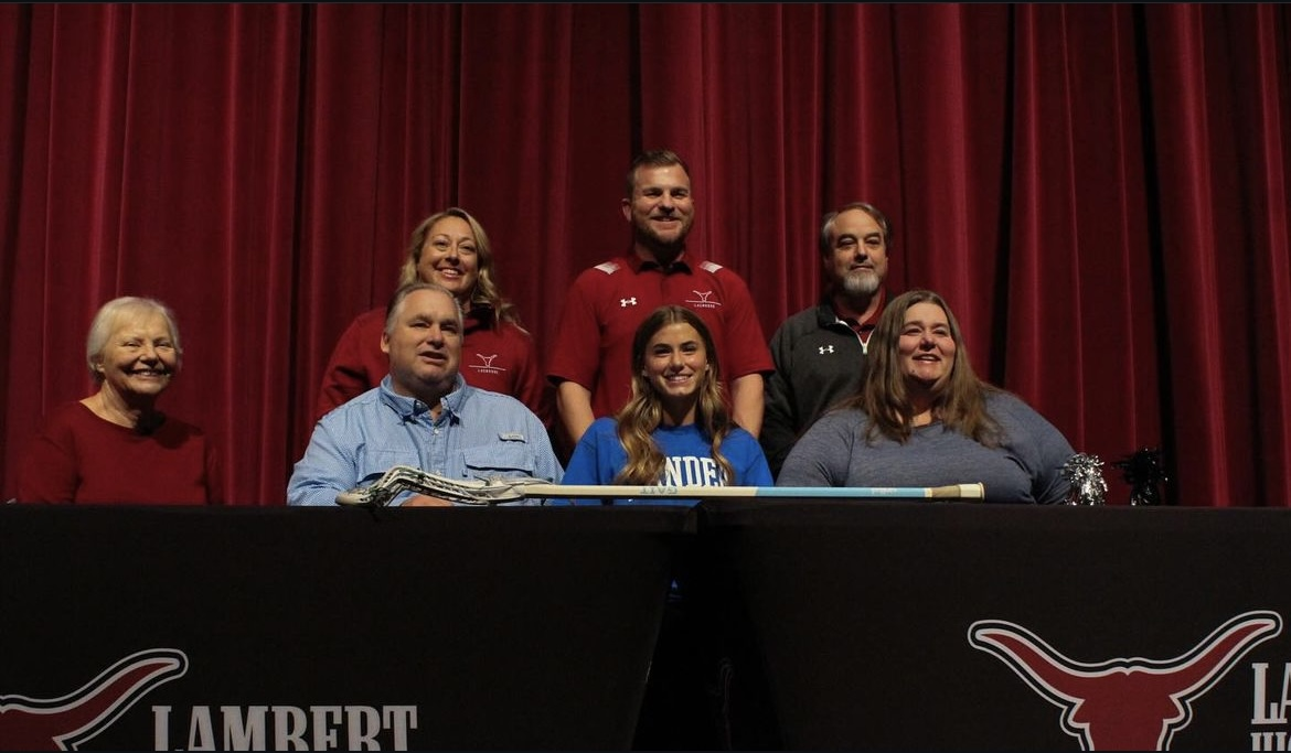 Kara Lindsey at Lambert signing day, signing her commitment letter to Lander University. (Lambert Post)