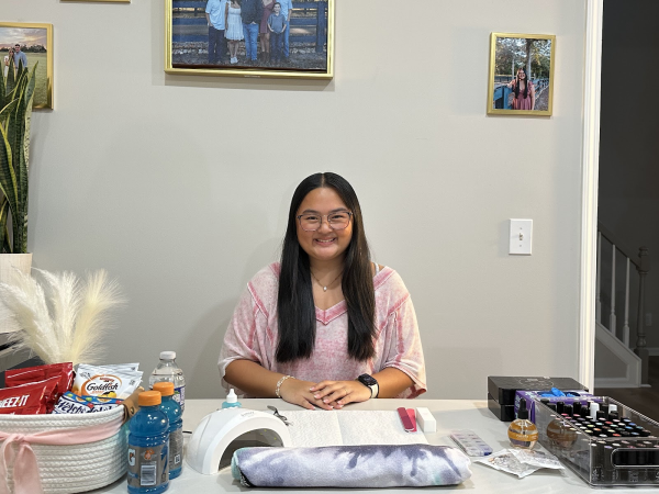 Ava Yang is shown with her supplies for her nail salon.  (Tracy Ding)

