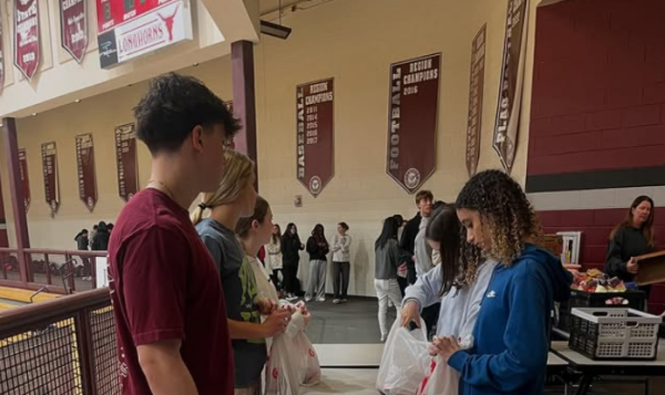 Students help pack donated food during a Blessings in a Backpack event. (Blessings in a Backpack)