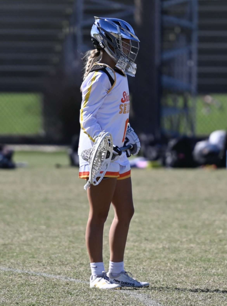 Sophia Hall playing lacrosse at a tournament

