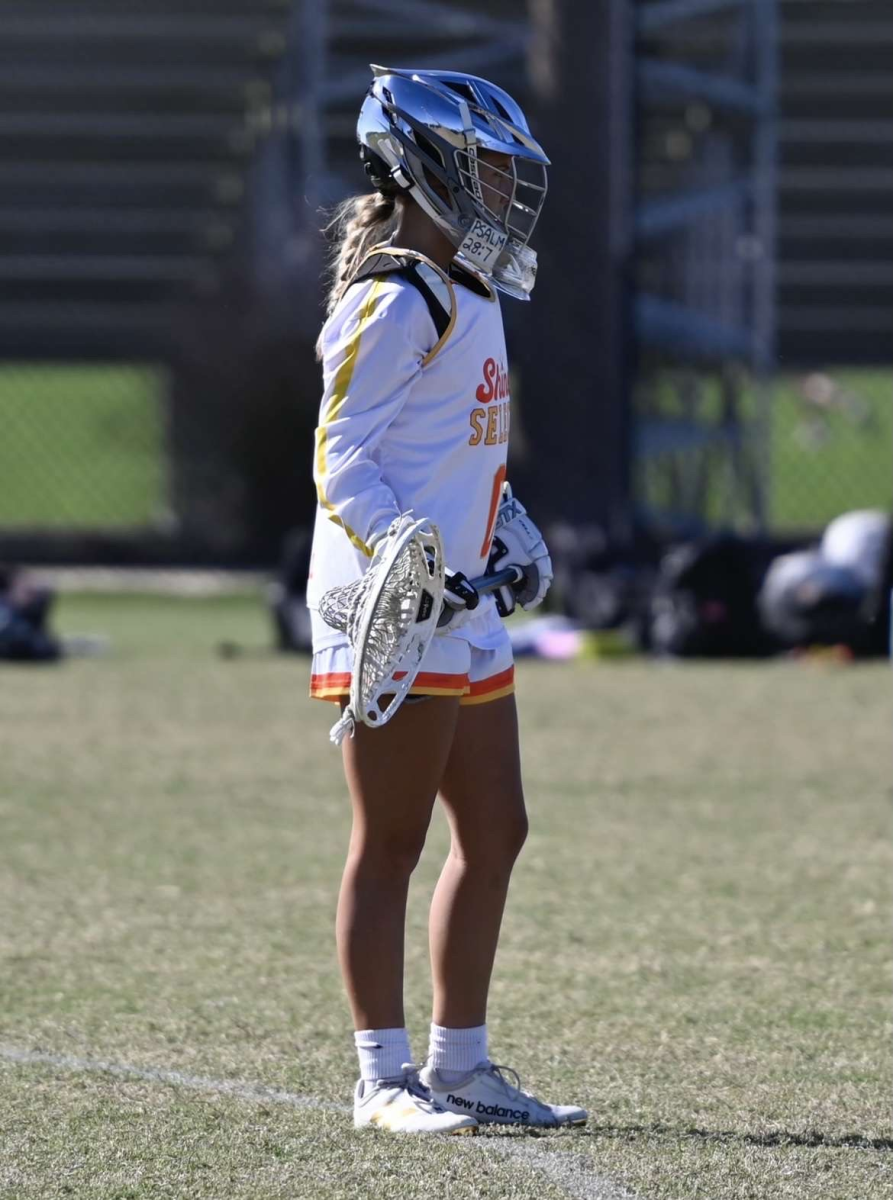 Sophia Hall playing lacrosse at a tournament

