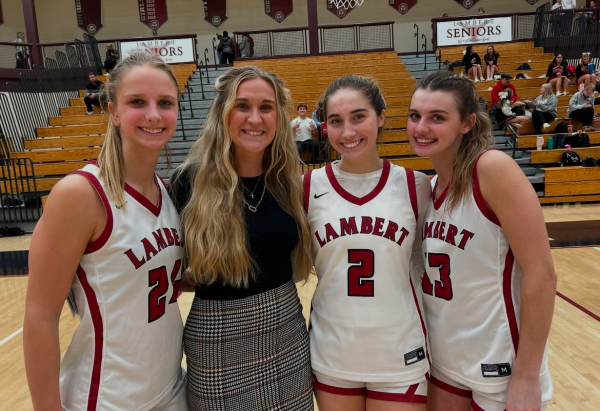 Left to right: Kenzie Weyer, Jordan Hill, Annarose Tyre and Olivia Brabazon at a basketball game at Lambert High School. (Photo @lamberthslonghorns on Instagram