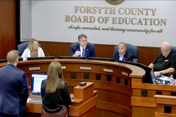 The image shows Superintendent Young at the Forsyth County Board of Education’s board meeting. (Travis Jaudon/Forsyth County News)