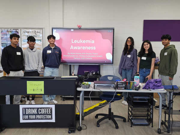 Rishik Devana, Ritik Devana, Tharun Dhamotharakannan, Alekhya Doddapaneni, Surabhi Fadnavis and Nikhil Vellanki giving a presentation at Lakeside Middle School.(Rishik Devana)