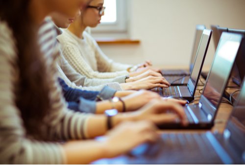 Students taking a digital exam. Photo from 7EDU Impact Academy.