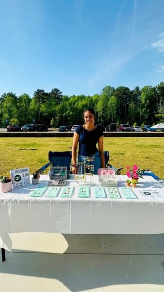 The image shows Sophomore Smayana Peddu with her business’s stall, Crafted By Smine. (Smayana Peddu)

