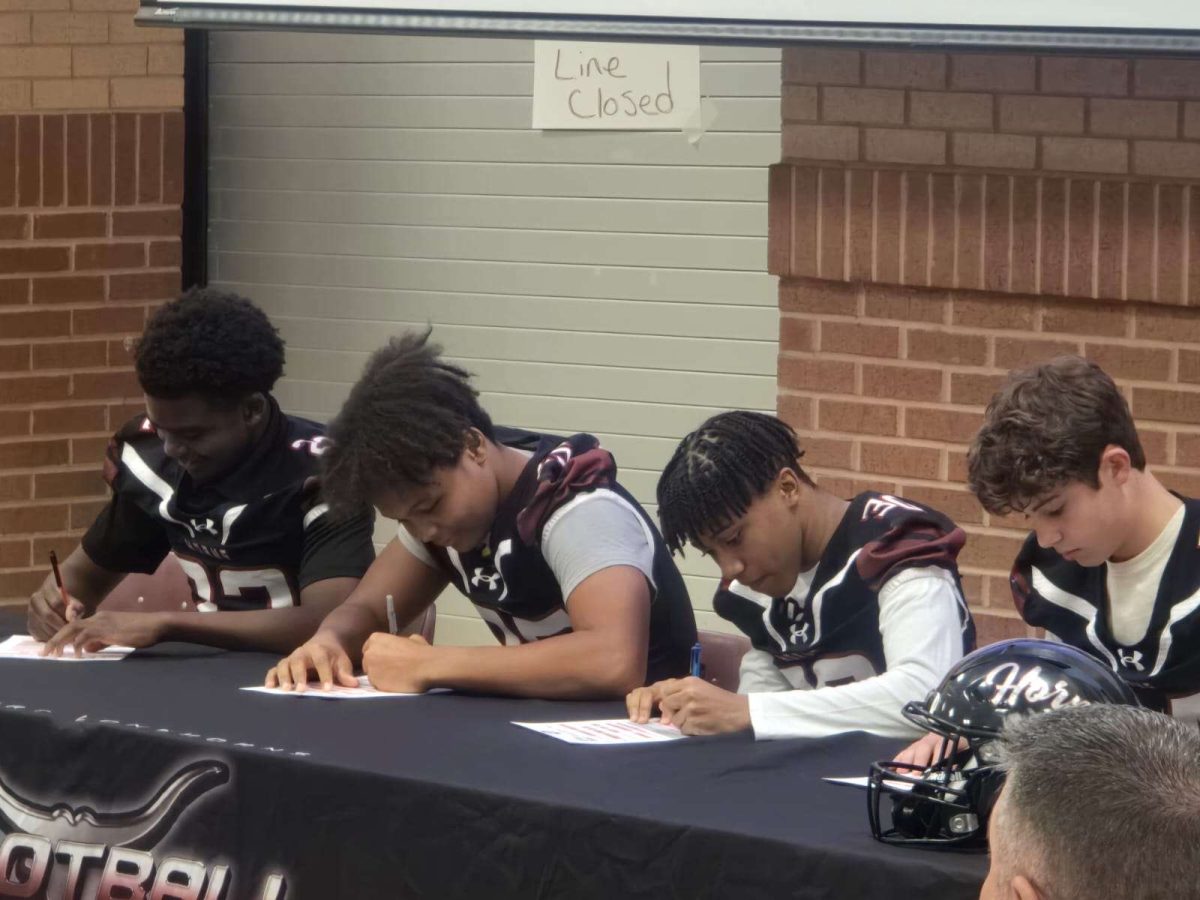 Mark Nannenhorn and MarcAnthony Smith signing onto Lambert Football (McKenzie Nannenhorn).