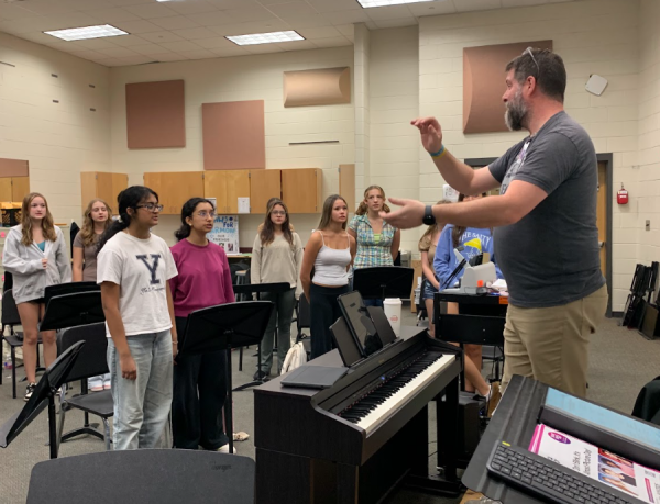 Mr. Wason teaching the Concert Chorus the Star Spangled Banner (Sophie Borski/The Lambert Post).