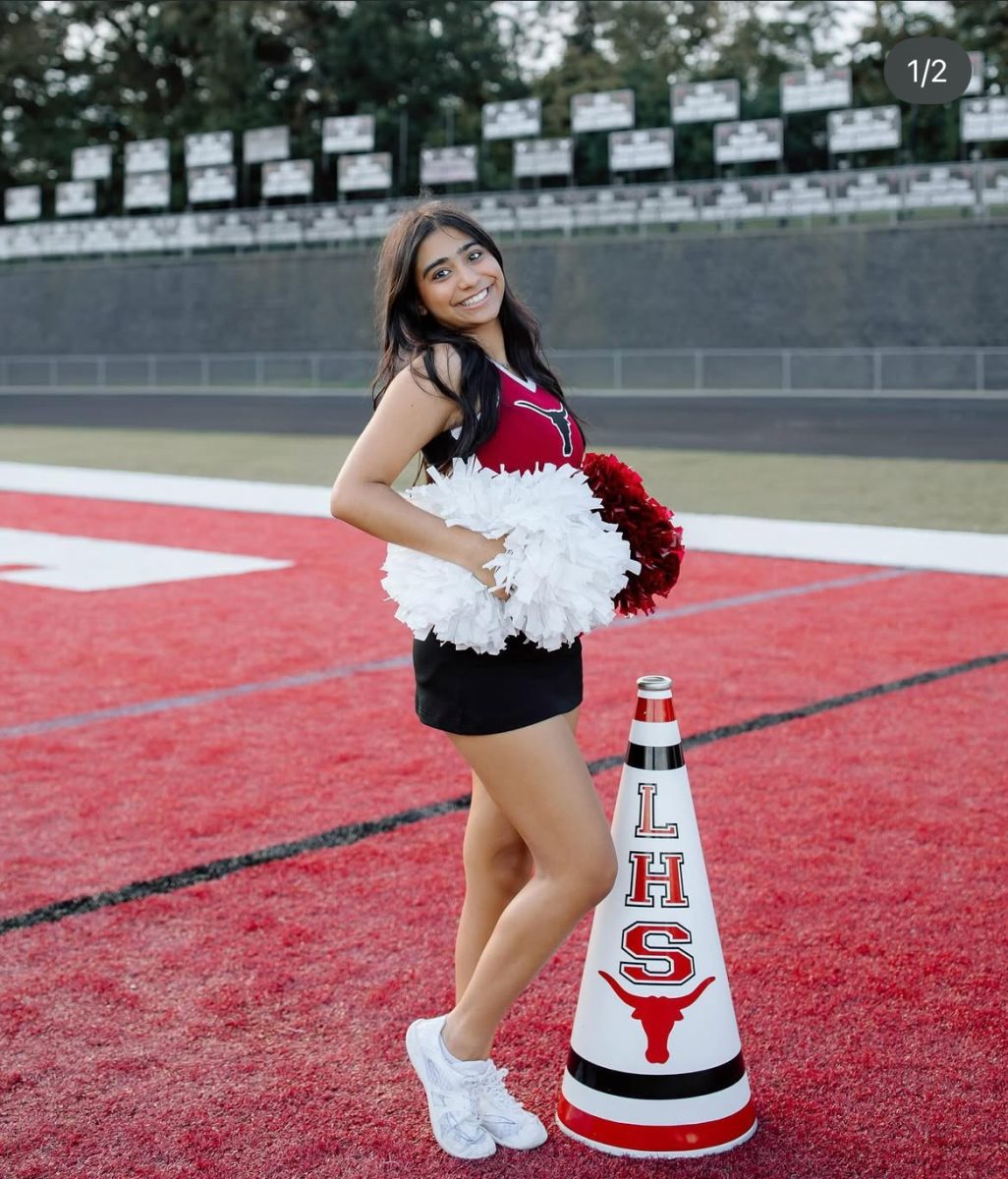 Ensiya posing for her cheer photos (Ensiya Jiwani).