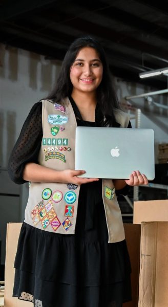 Loladia holding one of the donated electronics (Nazeefa Loladia).

