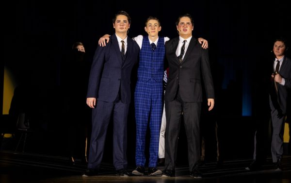 From left to right: Taylor Ingle, Andrew Chalmers and Tyler Ingle take center stage in “How To Succeed In Business Without Really Trying” (Taylor Ingle).

