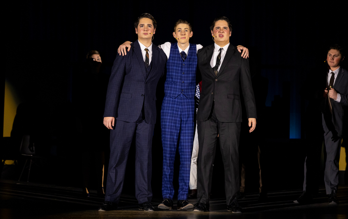 From left to right: Taylor Ingle, Andrew Chalmers and Tyler Ingle take center stage in “How To Succeed In Business Without Really Trying” (Taylor Ingle).