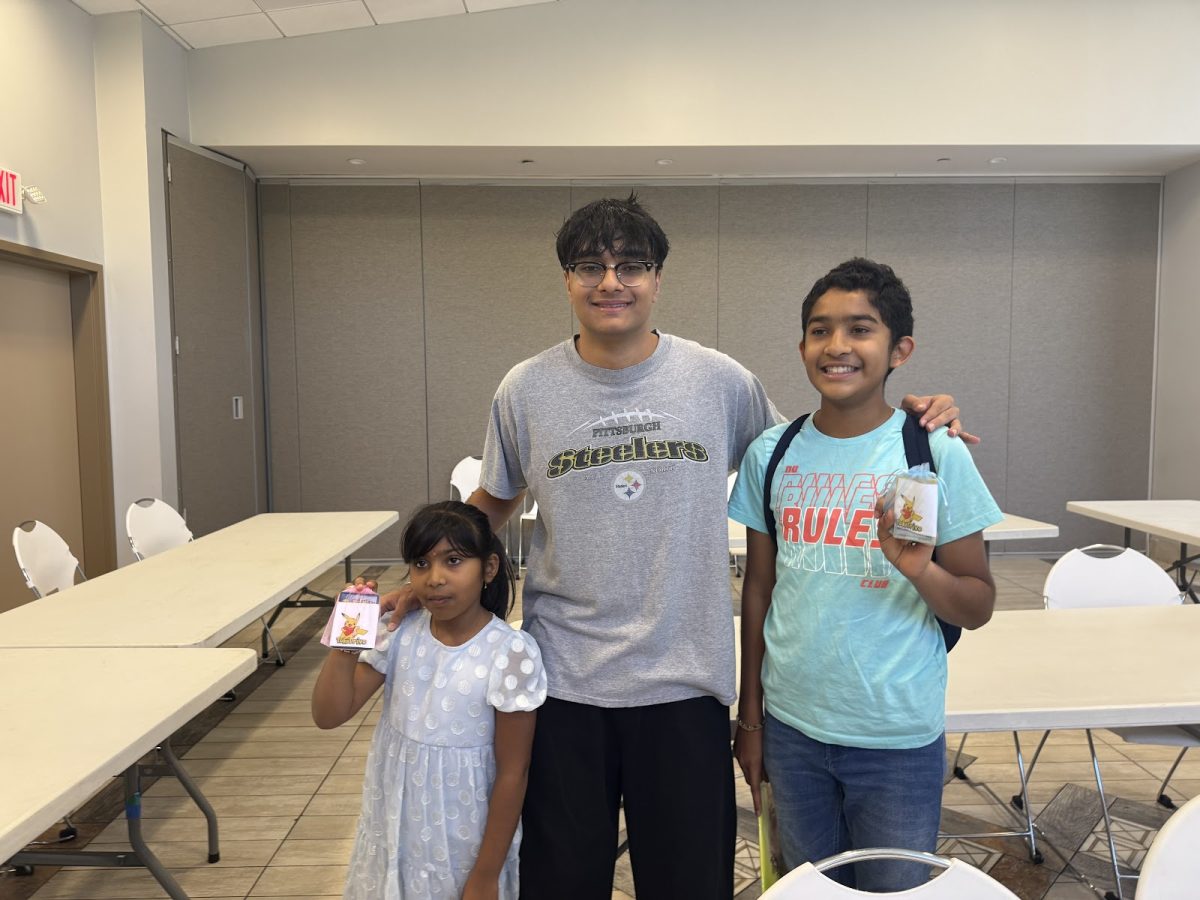Bhanja and kids at his PokeDrive event collecting Pokemon cards (PokeDrive/Lambert Post).