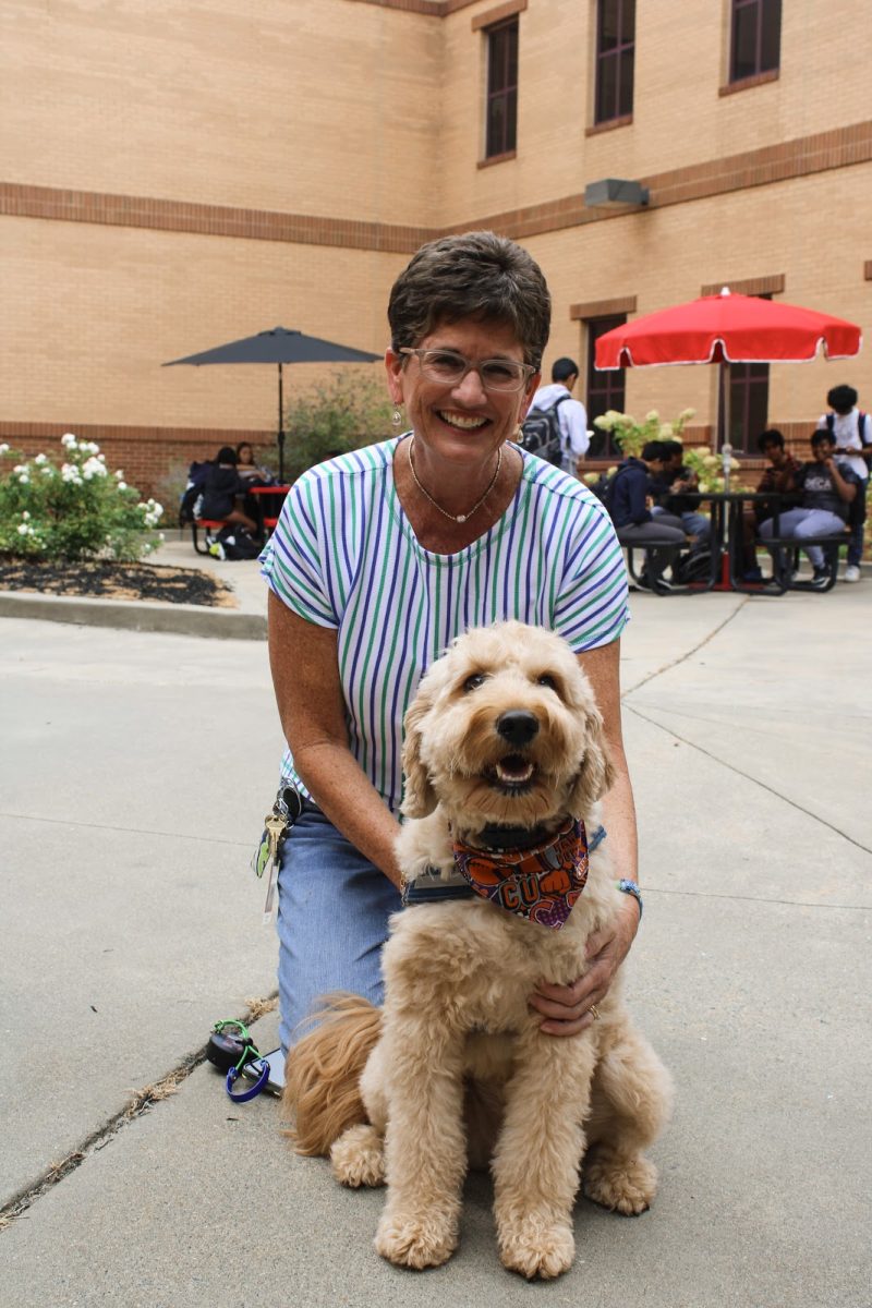 Mrs.Raines posing with Archie in the 1300s courtyard (Kim Raines).