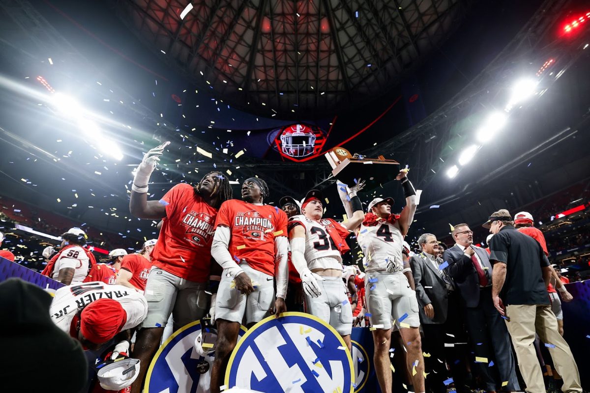 Georgia celebrating after beating Alabama in the 2025 SEC Championship (Royaltyfreepics).