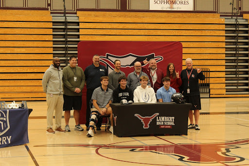 Lambert’s four signees with their coaches at 2026 Spring Signing Day (Bianca Anton/Lambert Post).