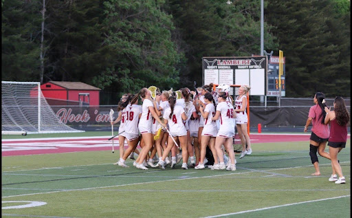 The Lambert Girls Lacrosse Team celebrating their win (Lambert girls lacrosse).